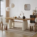 Modern Wooden Dining Table With White Legs And Upholstered Chairs Plus Vase Fruits Books And Pendant Lights