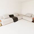 White Sectional Sofa With Multiple Cushions Black Blanket And Side Tables 3d model