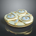 Golden Circular Decorative Object With Three Dials Intricate Engravings And Reflective Surface