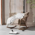 Stylish Beige Upholstered Rocking Chair With White Blanket And Wooden Frame In Cozy Indoor Space With Green Plant