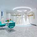 Elegant Bridal Shop Interior With White Decor Turquoise Chairs And Wedding Dress Displays