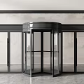 Modern Revolving Door Entrance Design With Glass Panels And Black Metal Frame