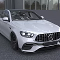 White Mercedes AMG Sedan With Sporty Front Grille And Black Alloy Wheels