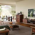 Cozy Integrated Living And Dining Room With Warm Wooden Furniture And Bright Natural Daylight
