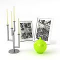 Bright Green Vase With Floral Design And Framed Pictures Near Silver Candle Holder