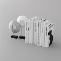 Modern Books And Magazine Display With Ring Shaped Decorations On Black Bases