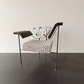 Modern Single Chair With Black Armrests Woven Geometric Seat And Metal Legs Design