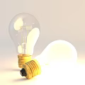 Two Transparent Incandescent Light Bulbs With Golden Bases Standing And Leaning