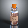 Clear Glass Bottle With Cork Stopper And Brown Powder Labeled CocoBitz