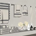 Gray Towels Hanging On Towel Rack And Folded On Bathroom Shelf With Decorative Items