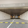 Modern Parking Garage Entrance With Clear Directional Signs And Yellow White Floor Lines