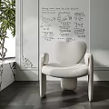 White Heart Shaped Accent Chair in Modern Interior With Marble Side Table And Green Plant