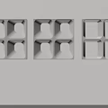 Three White Square Carved Decorations With Geometric Patterns On Light Wall