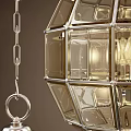 Three Modern Glass Globe Chandeliers with Metallic Grid Frame and Warm Lighting