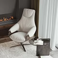 Modern Upholstered Leisure Chair in Cozy Living Room with Fireplace and Glass Side Table