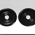 Two Black Circular Carved Intricate Home Decor Accents With Concentric Patterns