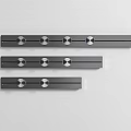 Three Sleek Long Modern Kitchen Appliances With Circular Control Knobs