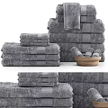 Gray Textured Cotton Towels Stacked With Hand And Bath Sizes And Wooden Bowl