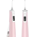 Two Pink Electric Water Flossers For Daily Oral Care With Modern Portable Design