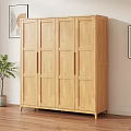 Natural Wood Wardrobe With Four Doors In Bright Room With Wooden Floor And Potted Plant