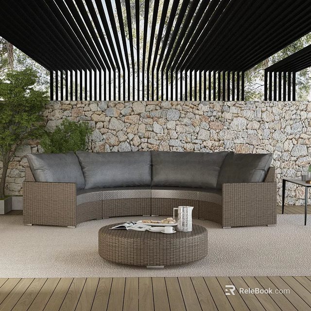Outdoor Wicker Sofa With Gray Cushions Round Coffee Table And Green Plants By Stone Wall 3d model 