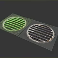 Two Round Metal Grilles With Striped Design On Dark Background