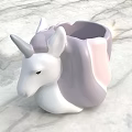 Cute Unicorn Shaped Cup With White Purple Pink Design On Marble Surface