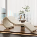Beige Plush Lounge Chair by Window with Blinds Side Table Plant Decor on Wooden Floor