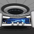 Modern Exhibition Hall With Circular Ceiling Lighting Large Tech Screens Silver Pillars And Meeting Area