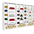 White Display Shelves With Multiple Compartments Displaying Colorful Items And Decorative Base