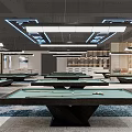 Modern Billiard Room With Multiple Green And Red Tables Marble Countertops And Area Rug