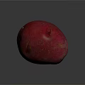Vibrant Red Potato With Smooth Skin And Oval Shape On Dark Background