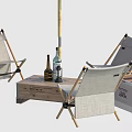 Outdoor Table Setup With Folding Chairs Orange Umbrella And Wooden Crate