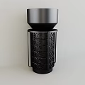 Modern Black Art Installation With Cylindrical Design And Geometric Laser Cut Pattern