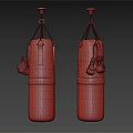 Two Brown Leather Boxing Punching Bags with Red Gloves Hanging as Sports Equipment