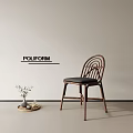 POULFORM Single Chair With Rattan Back In Minimalist Room Side Table Vase And Decorations
