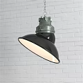 Industrial Style Pendant Light with Black Lampshade Green Metal Top Hanging Against White Brick Wall