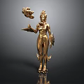 Golden Female Statue Holding Snake Object And Tray With Fin Decorations On Dark Background
