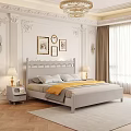 Light Gray Double Bed with Yellow Blanket White Pillows Table Lamps and Decorative Columns