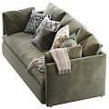 Luxurious Green Velvet Sectional Sofa With Multiple Decorative Pillows And Cozy Throw Blanket