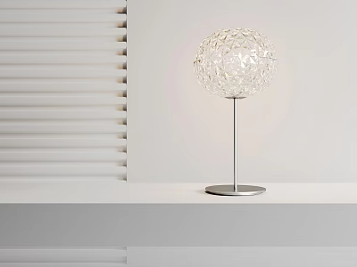 Modern Spherical Hollow Table Lamp With Silver Metal Base On White Tabletop 3d model