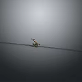 Small Mechanical Device On Long Metal Track In Gray Background