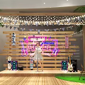 Female Singer Performing On Stage With Wooden Backdrop Neon Sign Guitar Speakers And String Lights