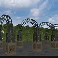 Ornate Metal Pergolas With Arched Design Carved Stone Bases Green Trees Blue Sky