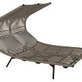 Woven Rattan Lounge Chair With Curved Design Light Cushions And Black Metal Legs