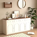 White Sideboard with Wooden Top Arched Doors Framed Pictures and Round Mirror in Living Area