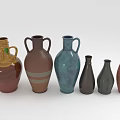 Different Green Plants Placed in Colorful Vases of Various Shapes