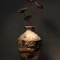 Rustic Handcrafted Ceramic Vases With Textured Earthen Tones And Dried Lotus Pods
