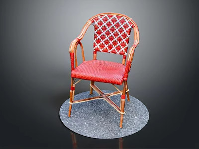Red Wicker Chair With Patterned Backrest Curved Armrests And Metal Frame On Round Gray Mat 3d model