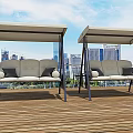Outdoor Swing Chairs With Canopy Beige Gray Cushions Round Pillows On Wooden Deck City Skyline